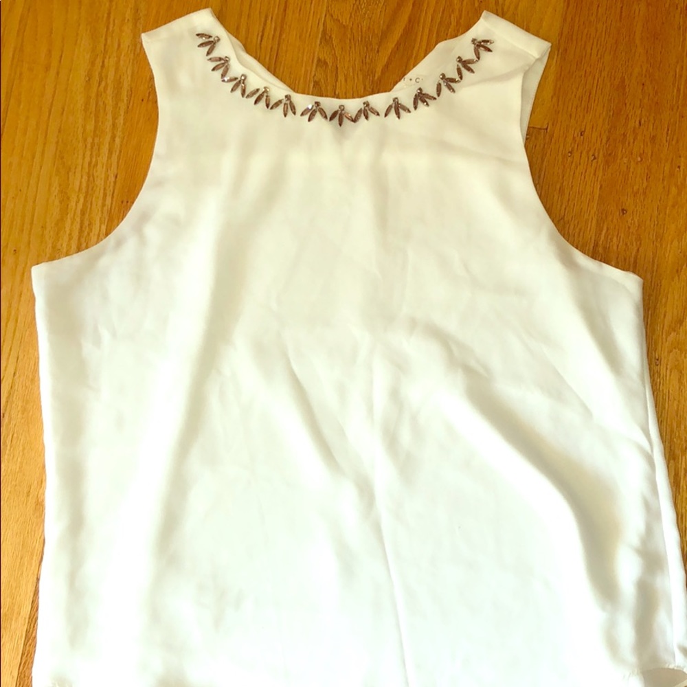 White polyester sleeveless blouse